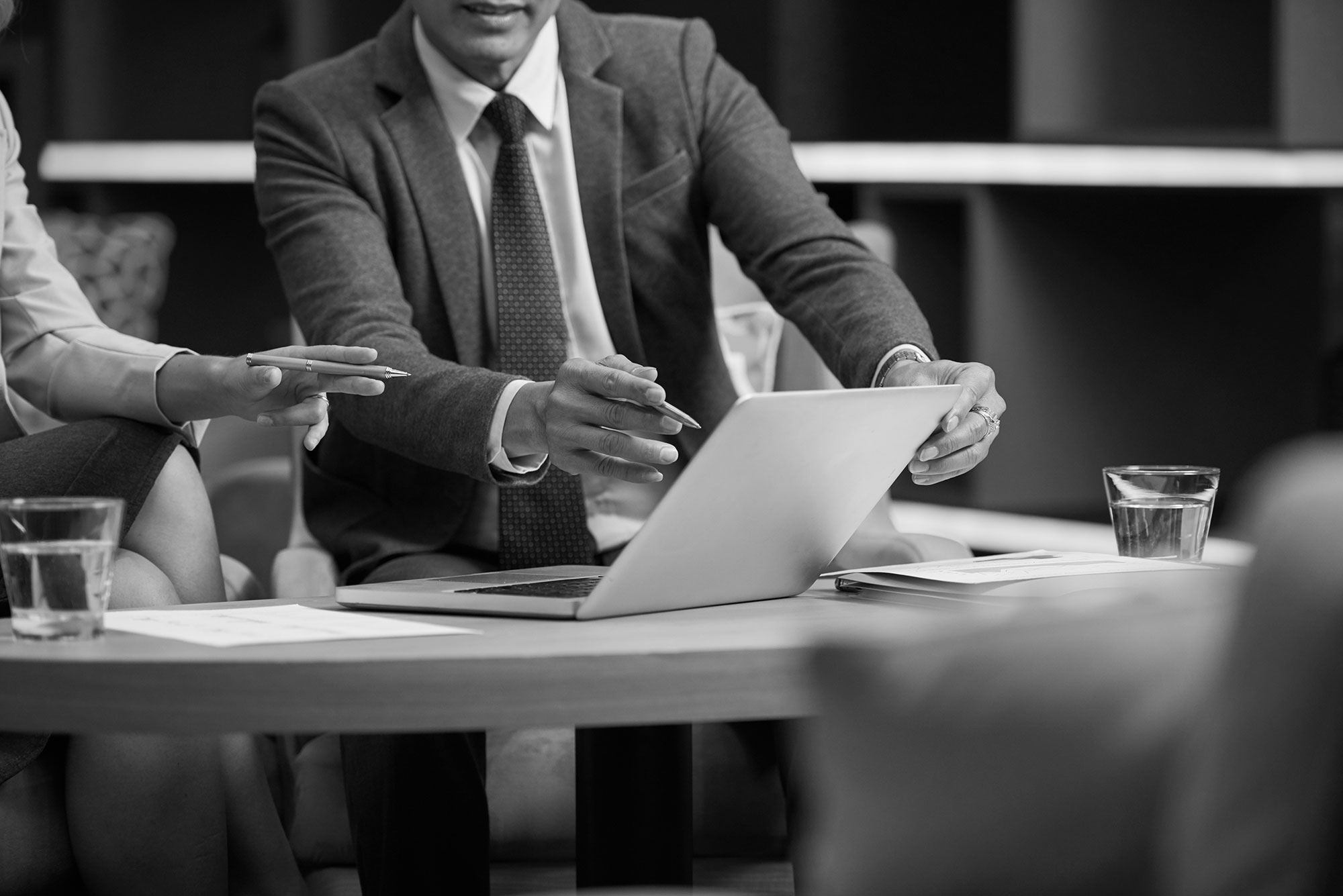 Business meeting with a laptop on a boardroom table