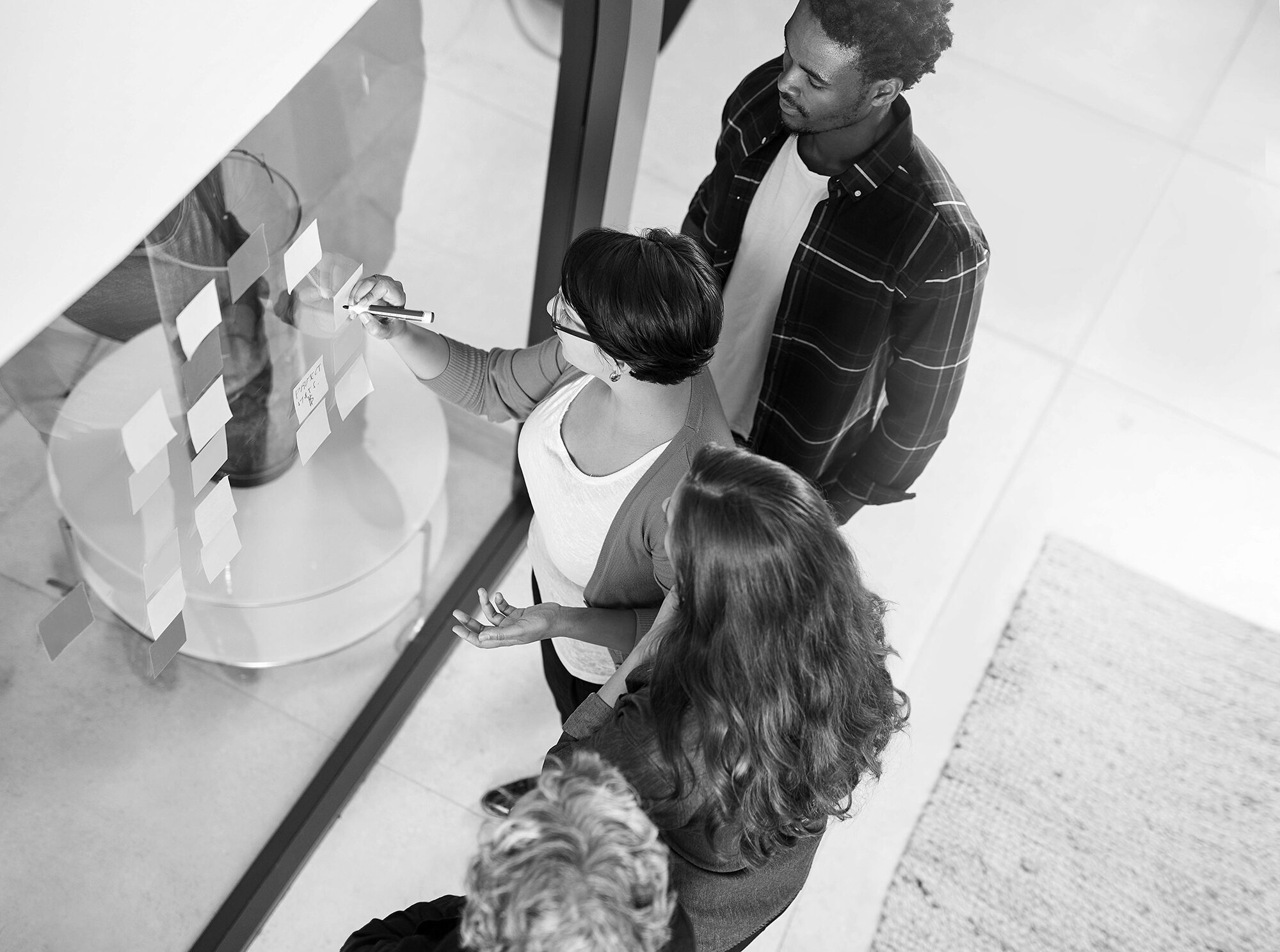 Overhead view of a team reviewing plans together