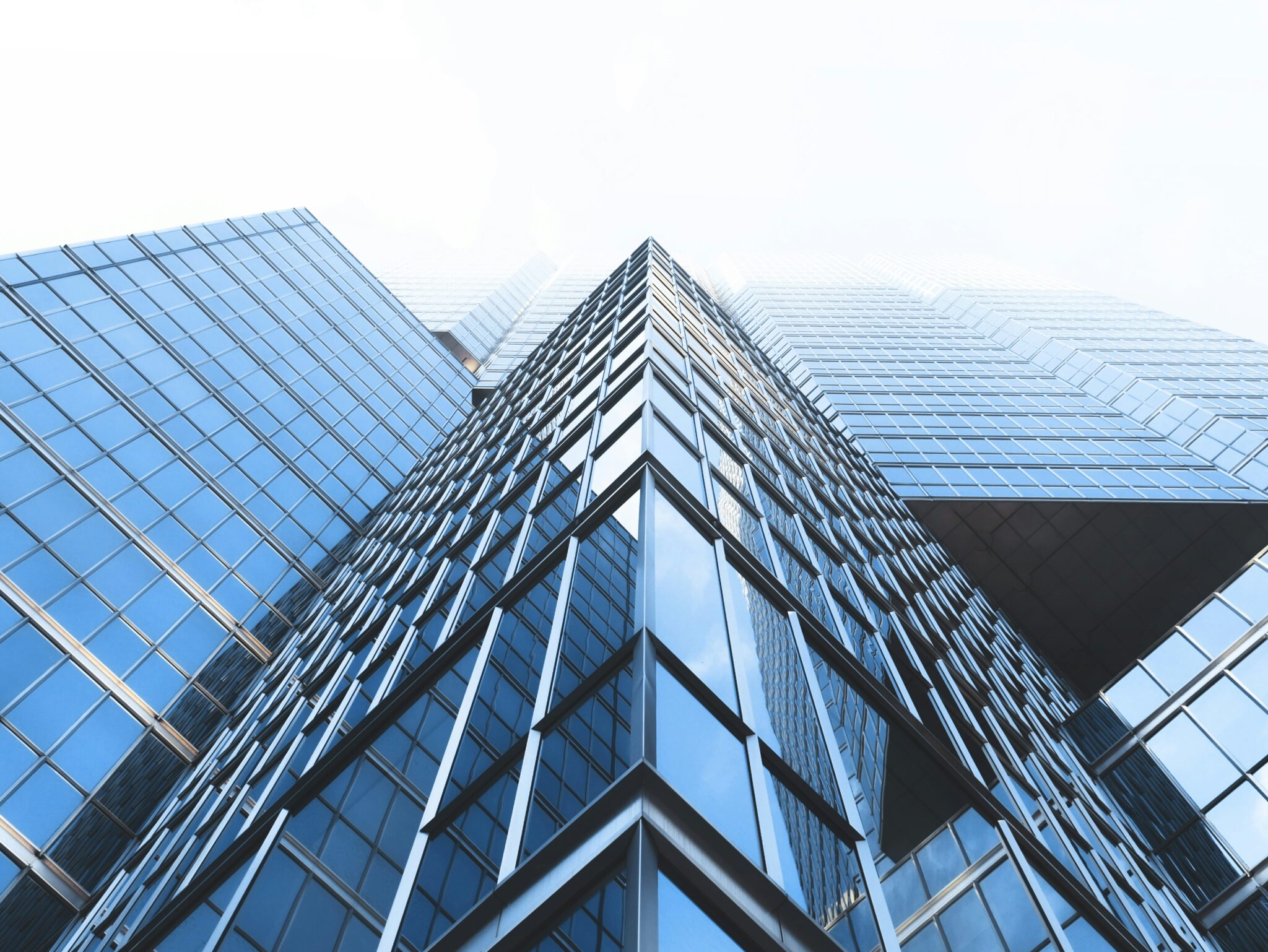 Looking up at a glass office tower